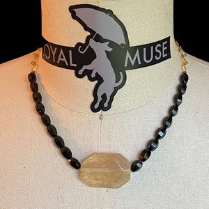 Smokey Quartz with Black glass beads on gold chain.